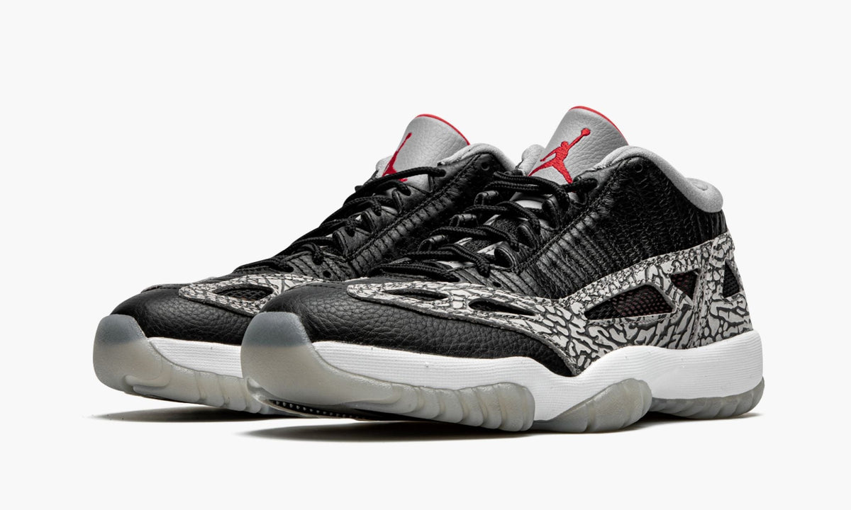 Air Jordan 11 Low IE "Black Cement" - Angle View 3